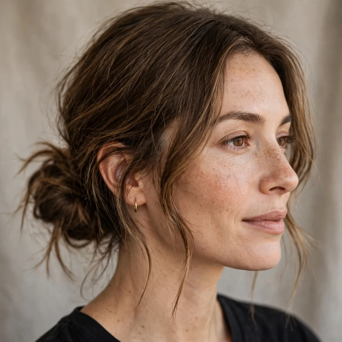 Low messy bun on medium hair